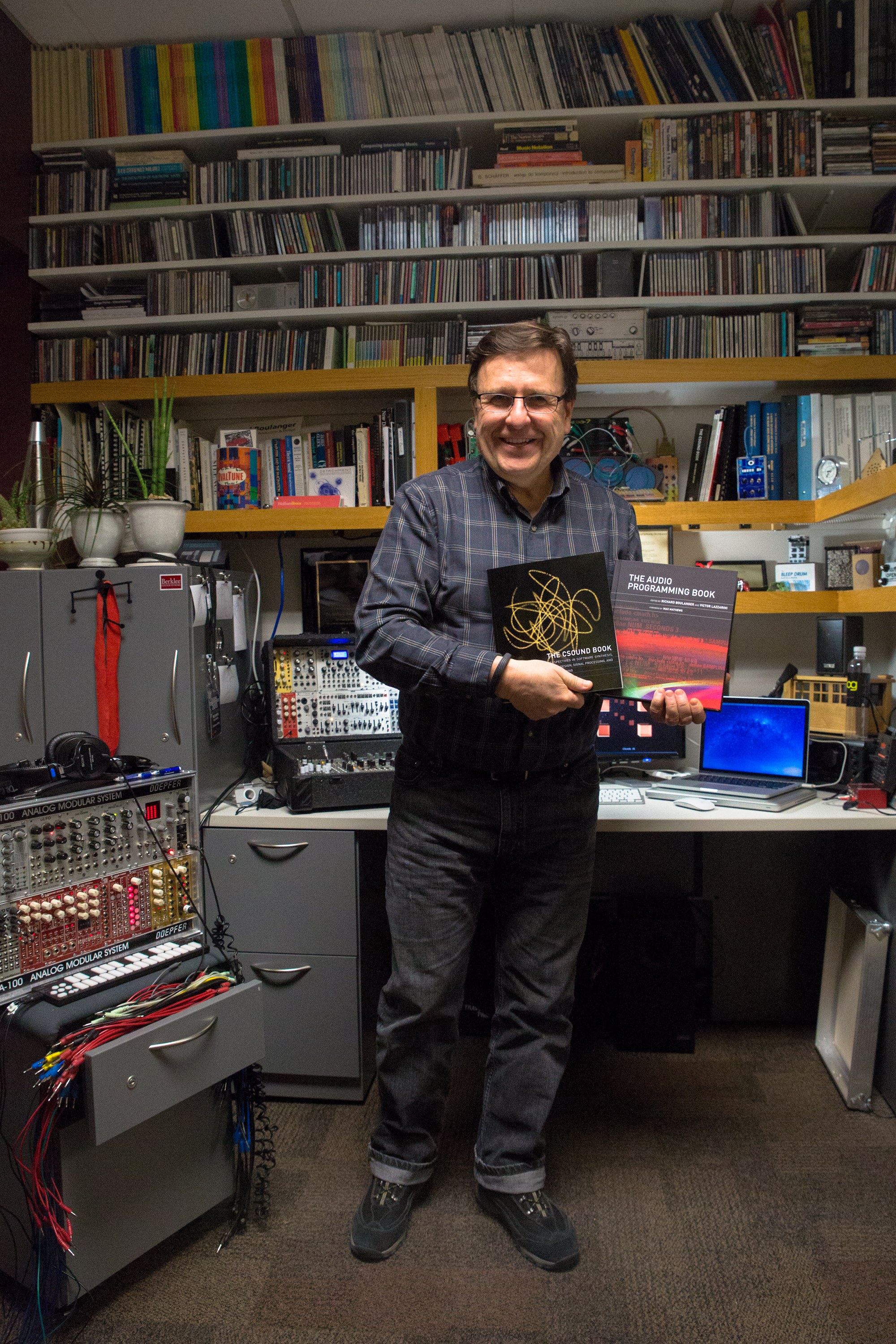 Dr. Boulanger with his books in the studio