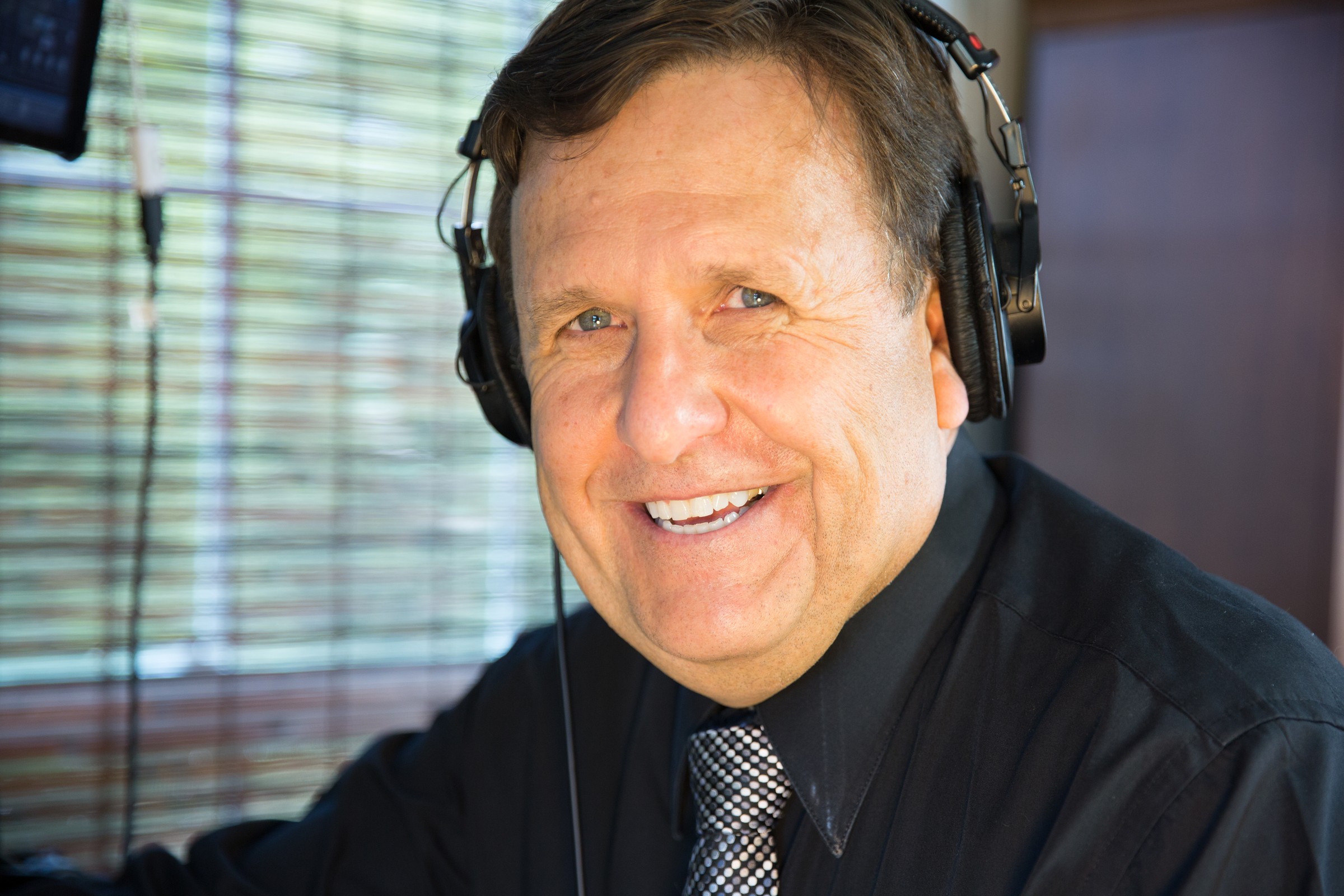 Dr. Boulanger with headphones smiling