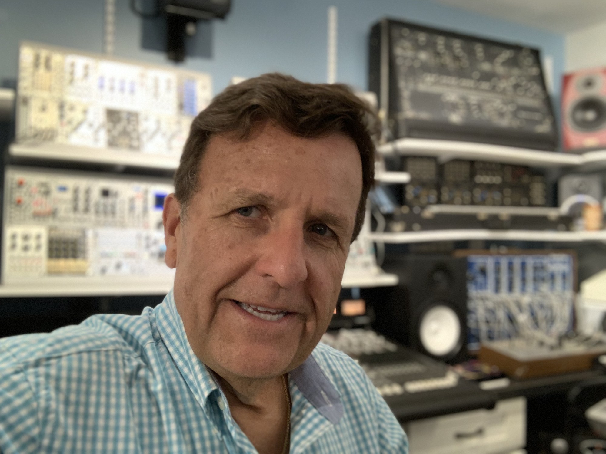 Dr. Boulanger leaning in the studio