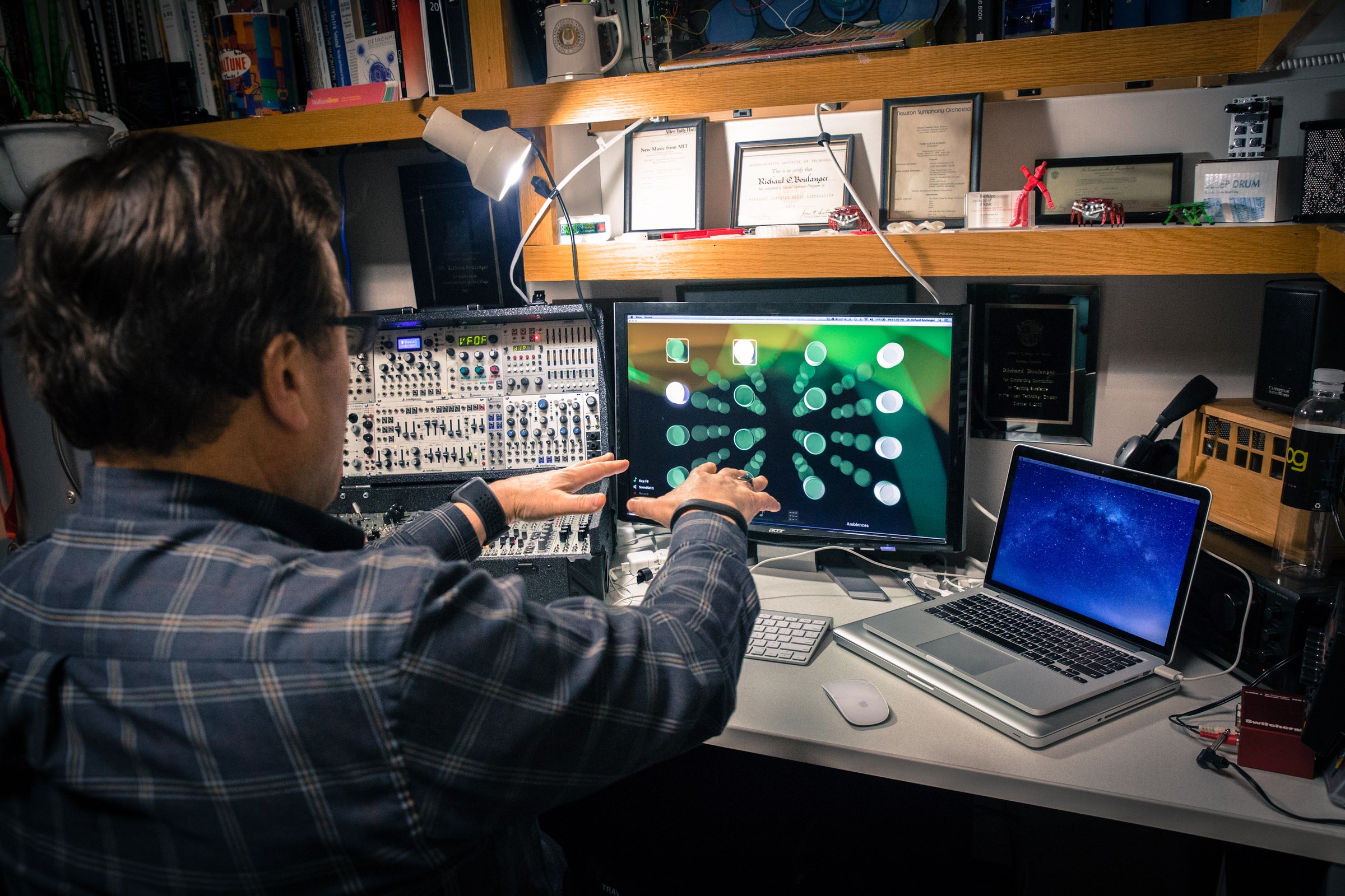 Dr. Boulanger at the studio desk with modular system